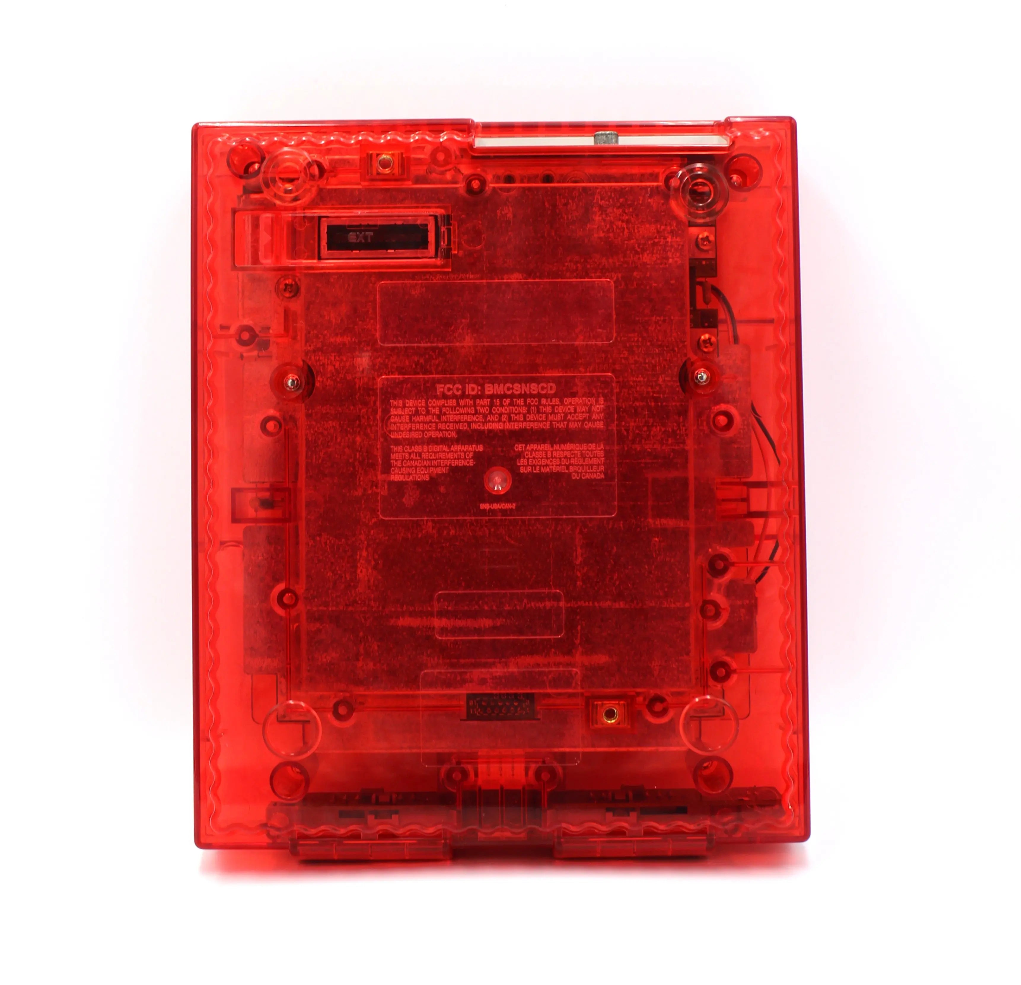 SNES Console Top View: Refurbished Super Nintendo SNES with OEM controller and cables. 1991 NTSC-U console with a new translucent red shell motherboard. Image of bottom of the SNES showing Nintendo text and screws.