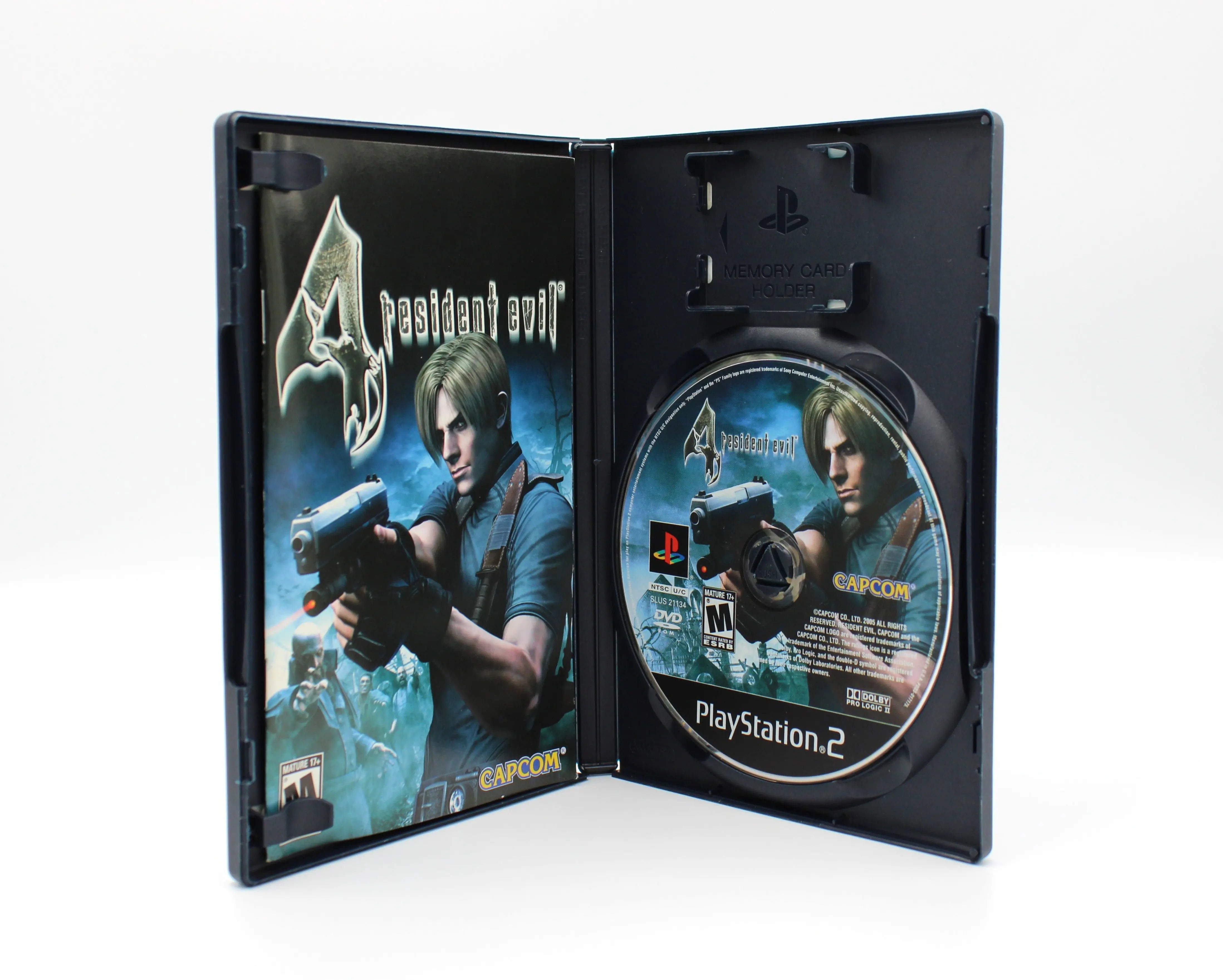 “Open case view of Resident Evil 4 black label (PS2 CIB, 2005) – Part of a Set – NTSC‑U, showing the manual on the left and the game disc secured on the right.”
