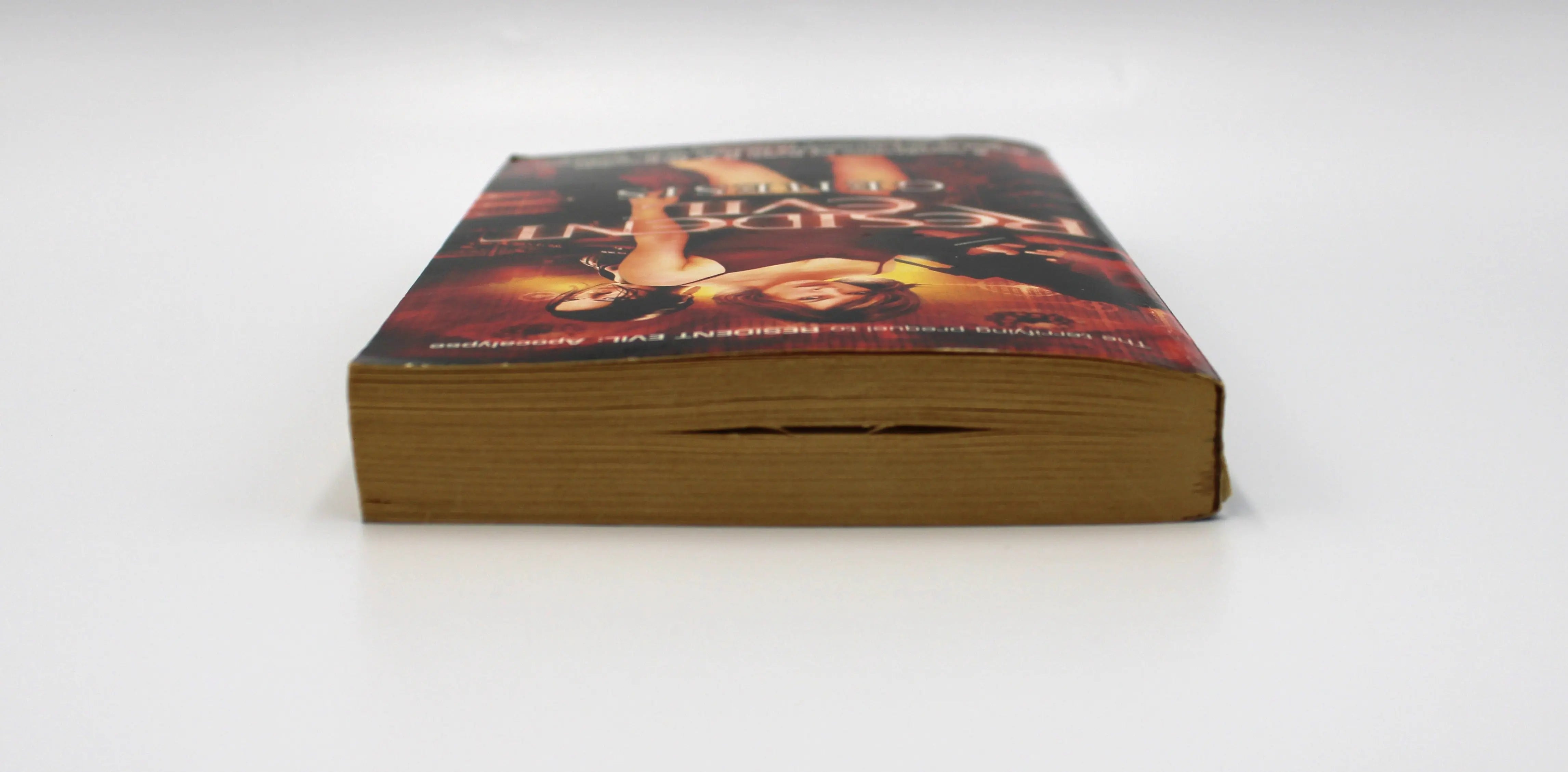 Top edge view of Resident Evil: Genesis paperback – shows aged paper toning and smooth binding on first print Pocket Star Books edition.
