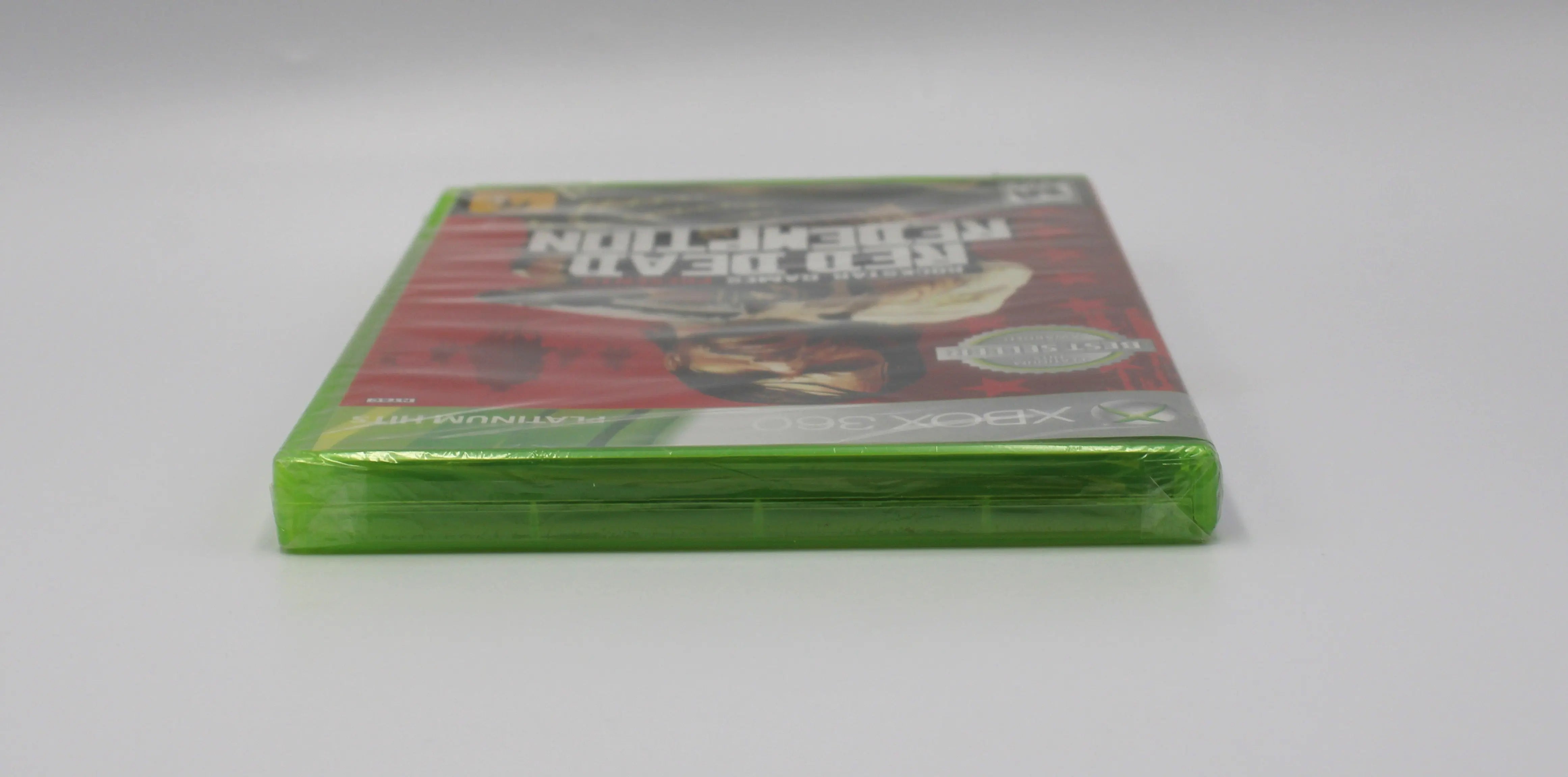 Top view of Red Dead Redemption for Microsoft Xbox 360 NTSC-U sealed game case, showing sealed edges and plastic wrap condition.