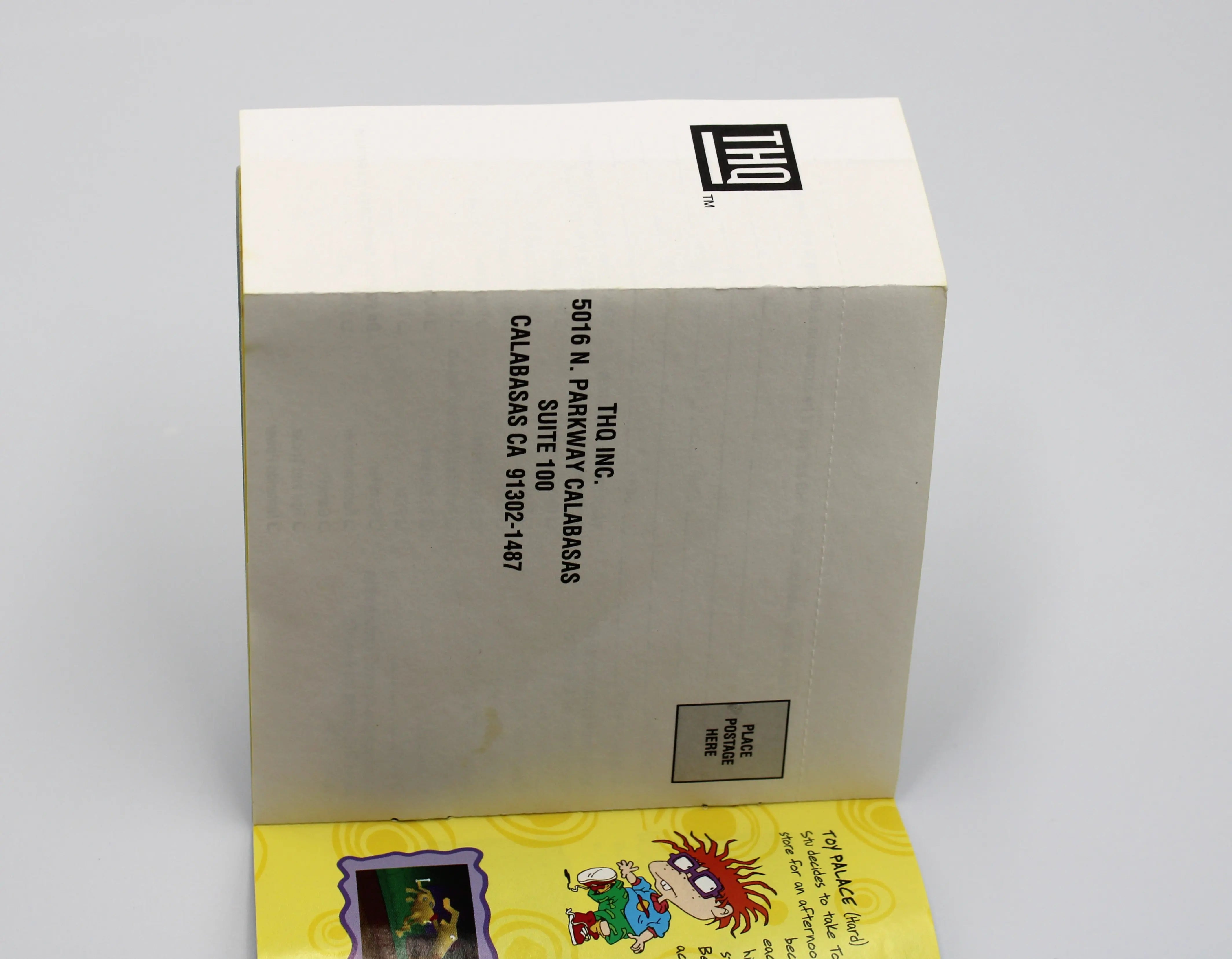 Registration card front: Front of the registration card for Rugrats: Search for Reptar for Sony PlayStation 1 (PS1) – CIB with Registration Card (1998) NTSC-U, black label edition, showing the registration form design and THQ logo with mailing address.