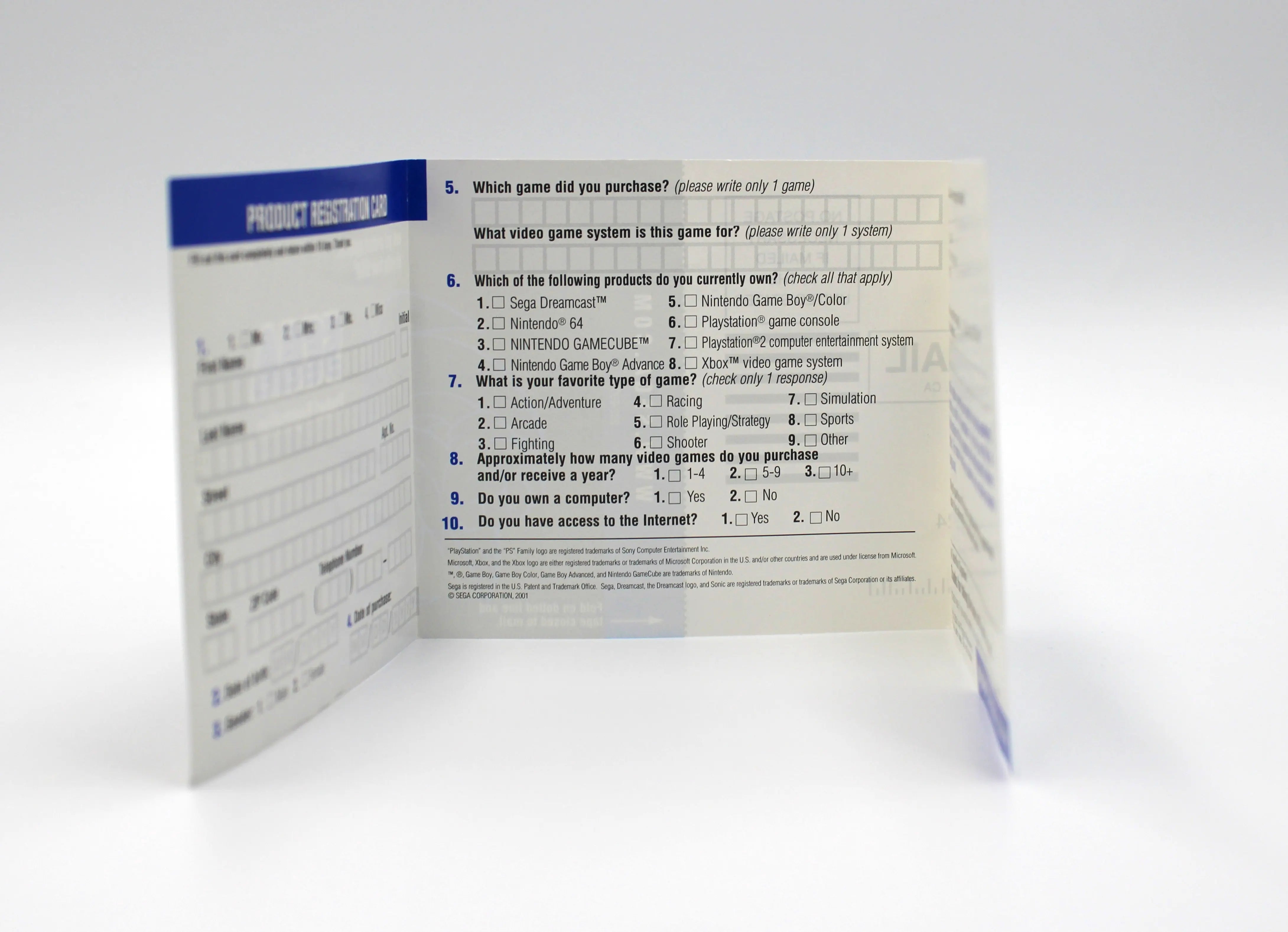 Opened interior view of SEGA registration card included with Ferrari F355 Challenge for PS2 (2002) NTSC-U. Shows printed survey about console ownership and gaming preferences.