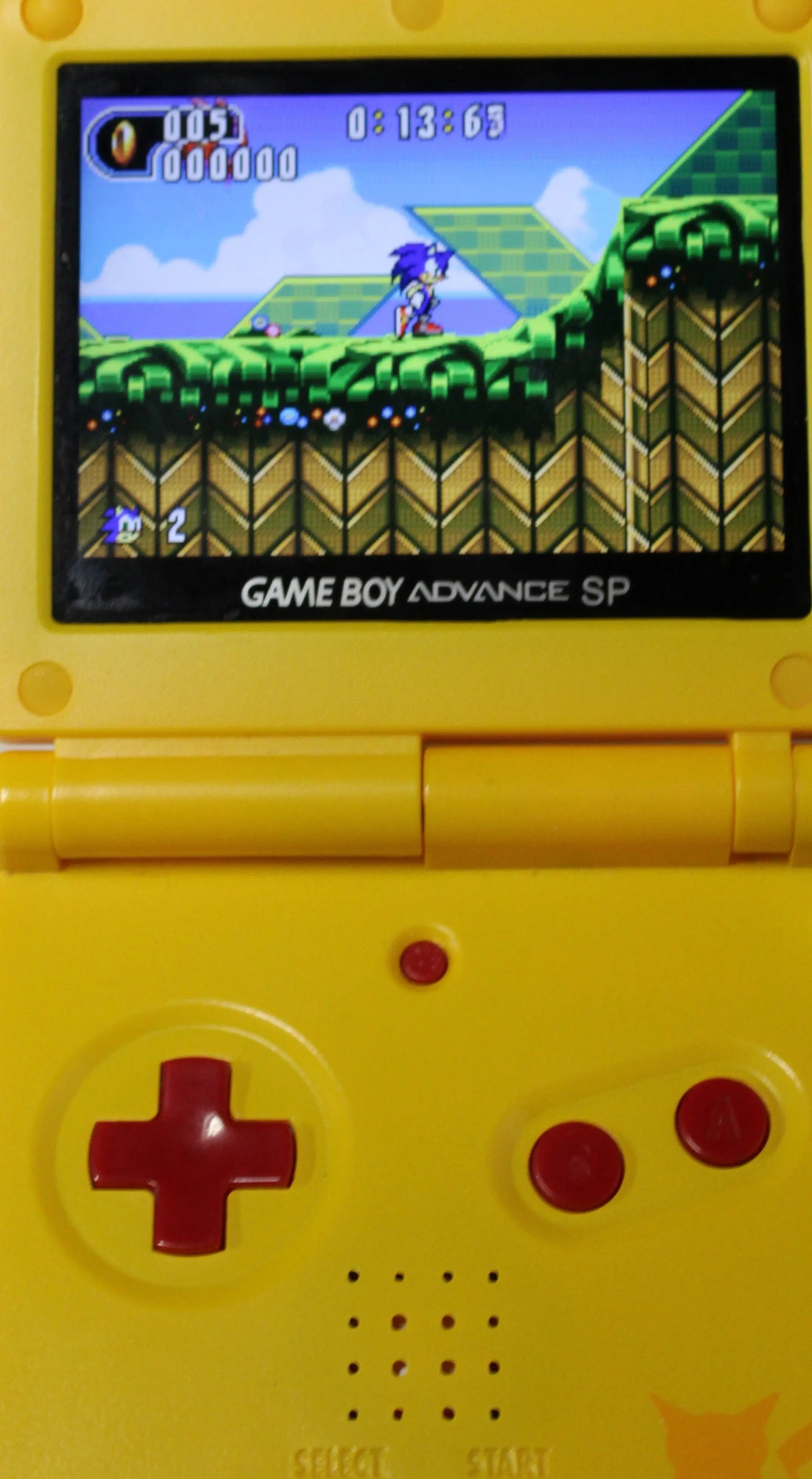 In‑game action of Sonic Advance 2 for Nintendo Game Boy Advance GBA – Authentic Game Cartridge (2002) NTSC‑U, showing Sonic running through a green‑hill style level with rings and enemies in view.