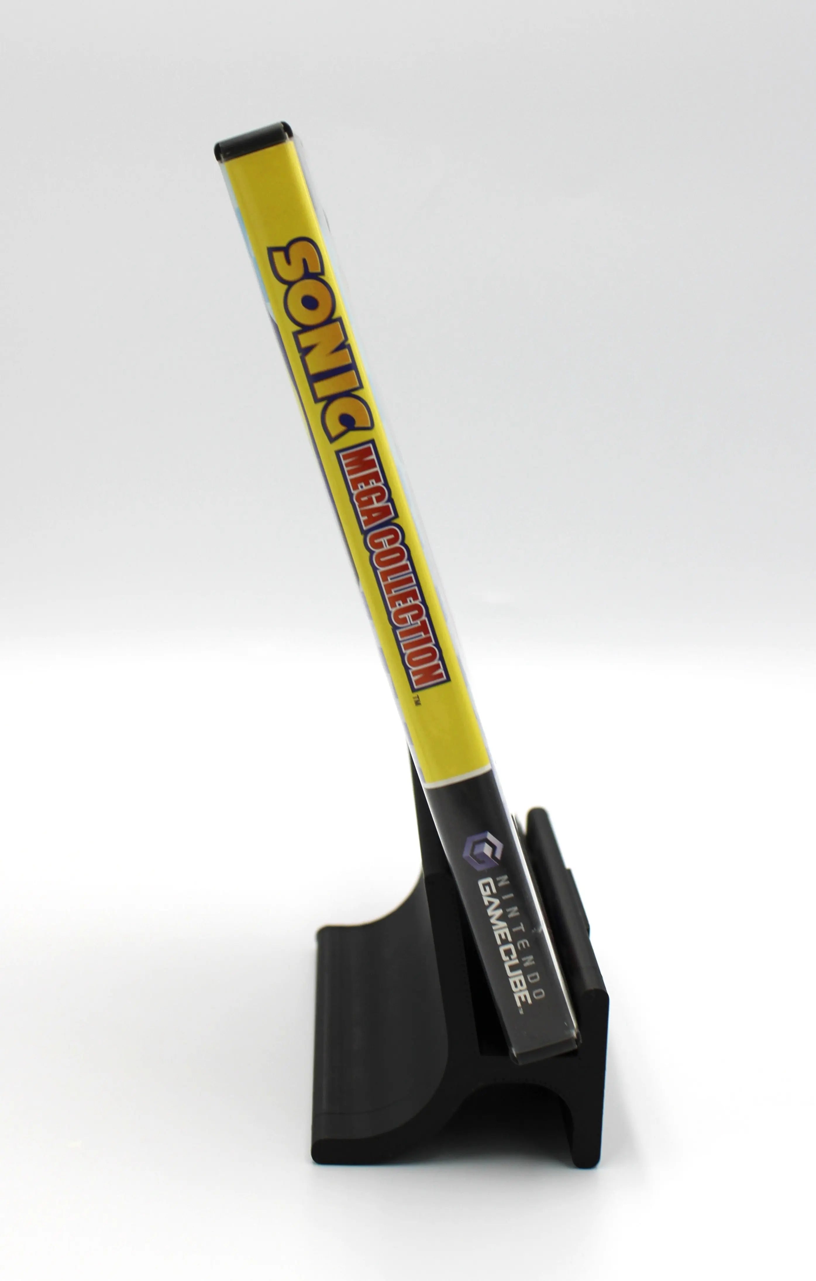 “Spine of Sonic Mega Collection for Nintendo GameCube – NTSC‑U black label CIB with Manual (2002), showing the title text and GameCube logo on a white background.”