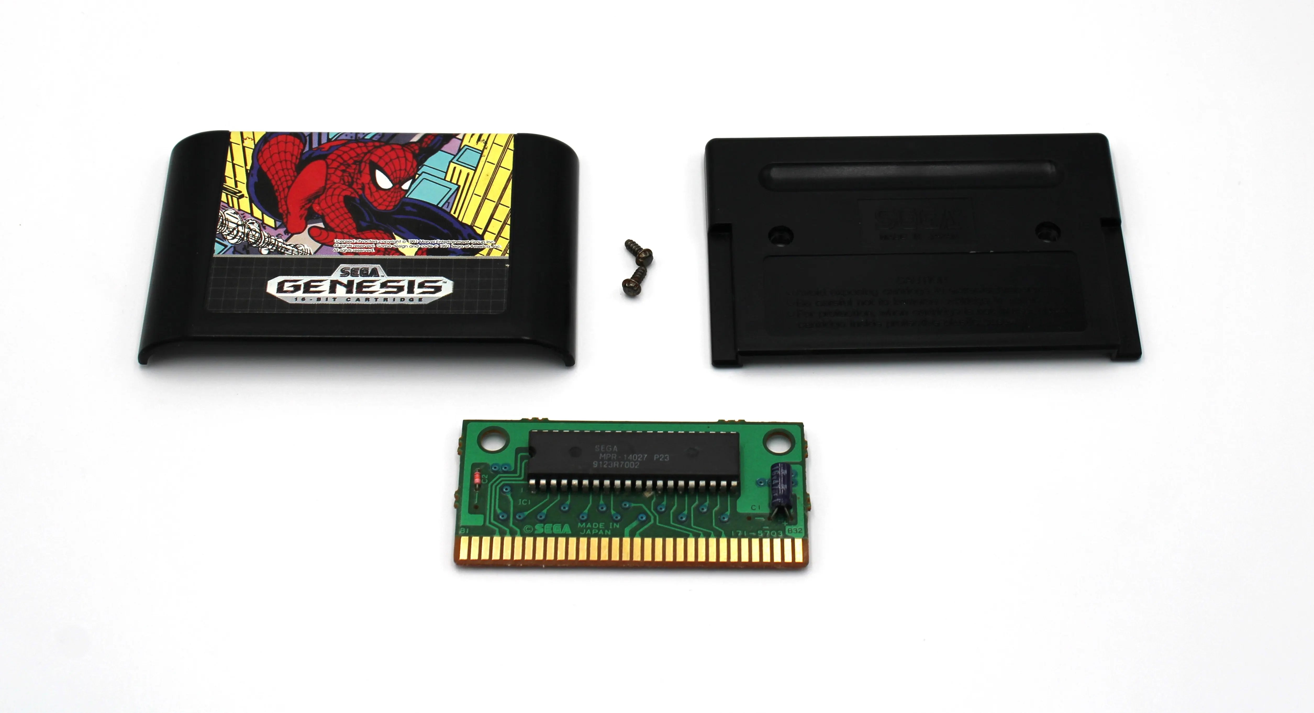 Fully disassembled view of Spider‑Man for Sega Genesis – Authentic Game Cartridge (1991), showing front shell, back shell, internal PCB, and security screw laid out on a clean white background for full authenticity verification.