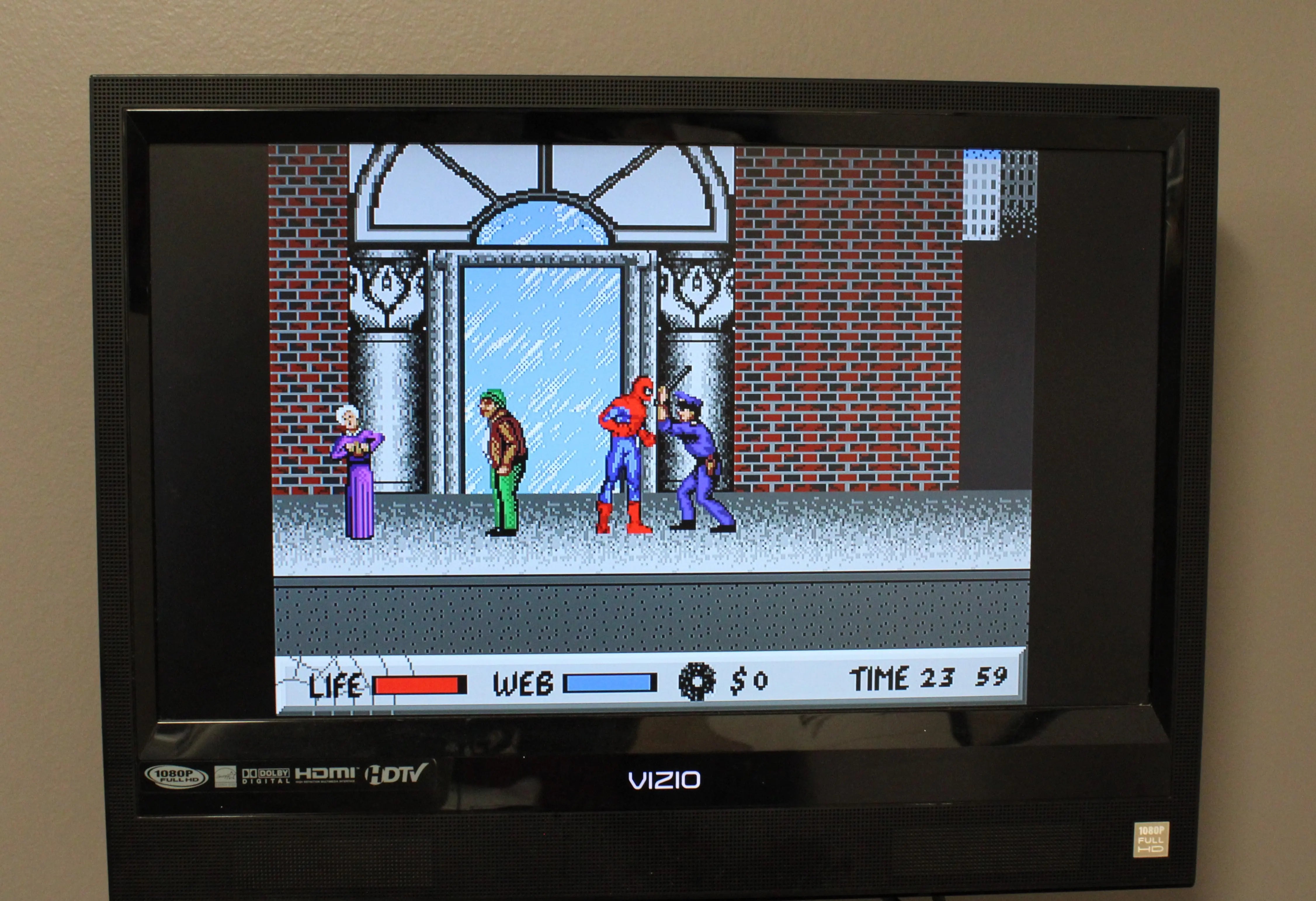 In‑game action of Spider‑Man for Sega Genesis – Authentic Game Cartridge (1991), showing Spider‑Man swinging between buildings and battling enemies with web attacks.