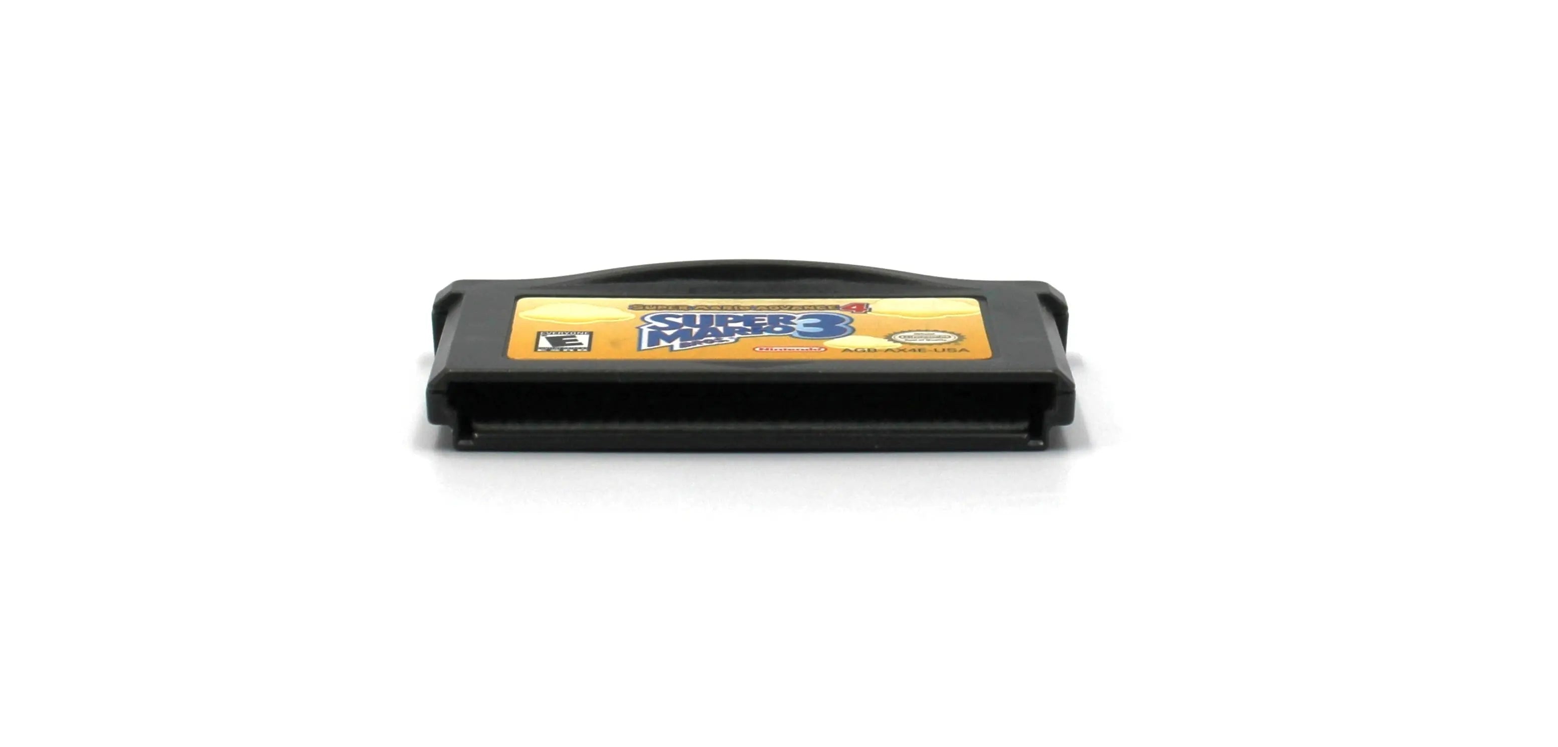 Bottom edge view of Super Mario Advance 4: Super Mario Bros. 3 for Nintendo Game Boy Advance GBA – Authentic Game Cartridge (2003) NTSC‑U, showing clean, authentic pin connector and internal board fit