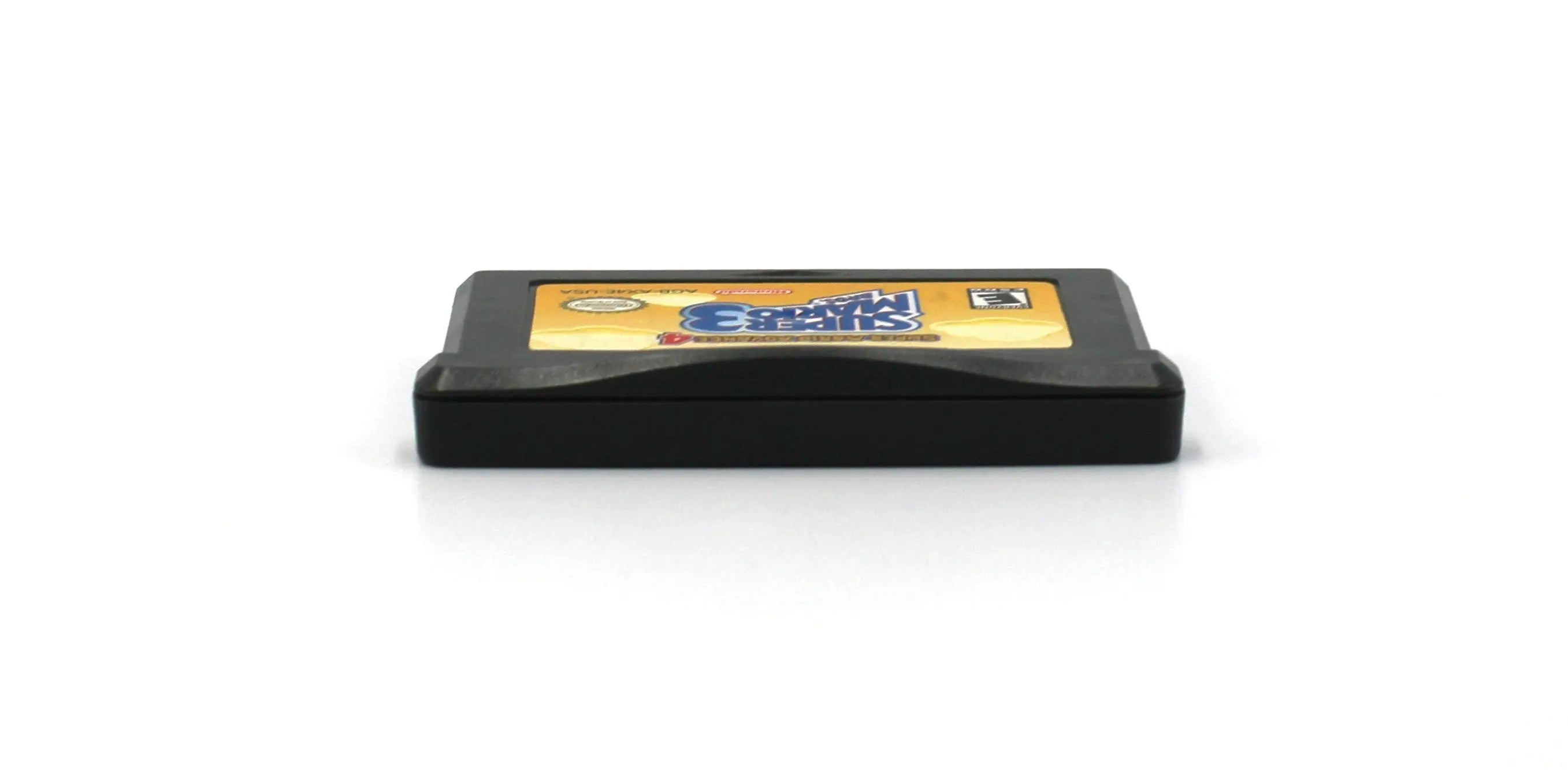 Top edge view of Super Mario Advance 4: Super Mario Bros. 3 for Nintendo Game Boy Advance GBA – Authentic Game Cartridge (2003) NTSC‑U, showing clean alignment of shell halves and label edge.