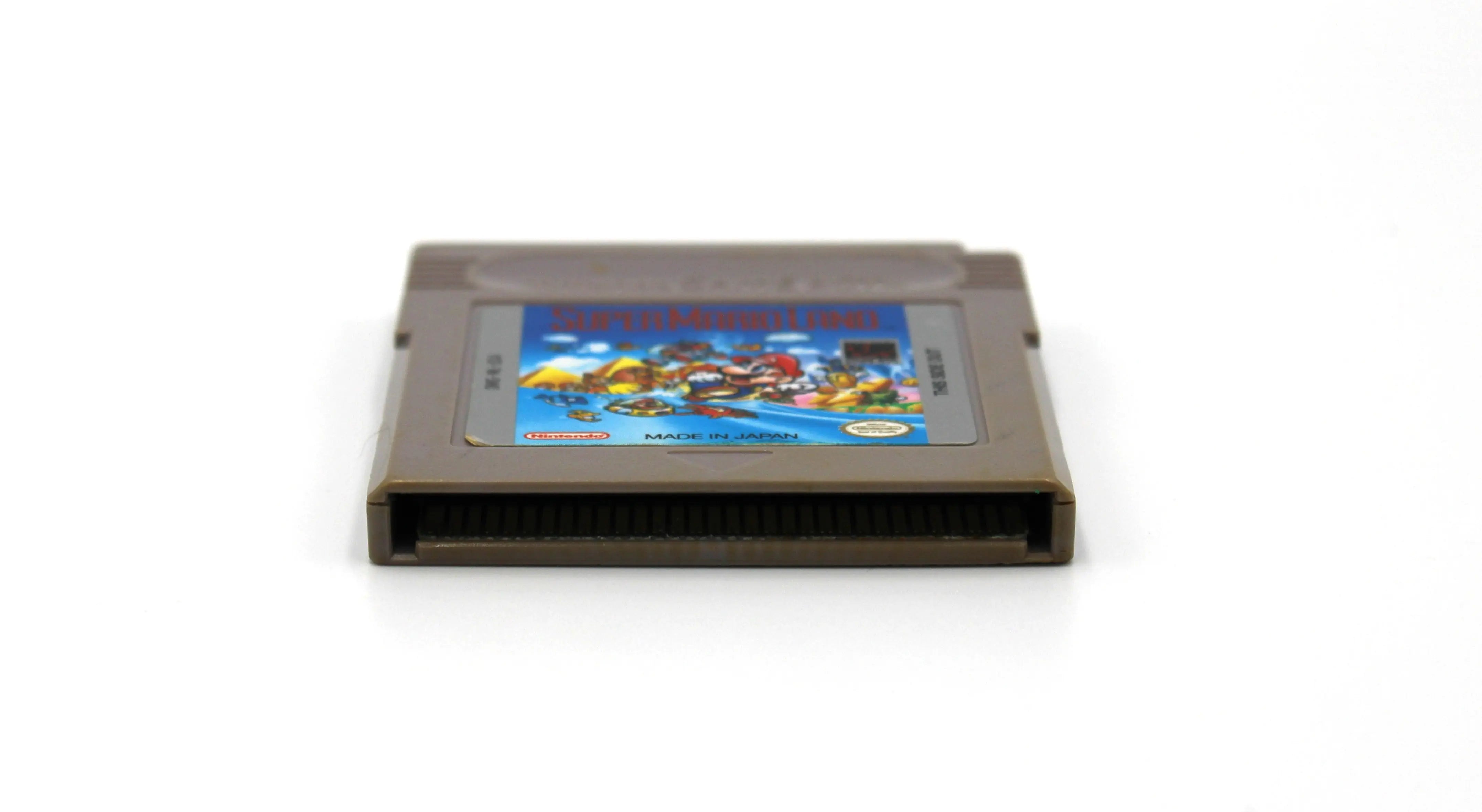 Bottom edge view of Super Mario Land for Nintendo Game Boy – Authentic Game Cartridge (1989) NTSC‑U, showing the straight, evenly spaced gold connector pins flush with the shell.