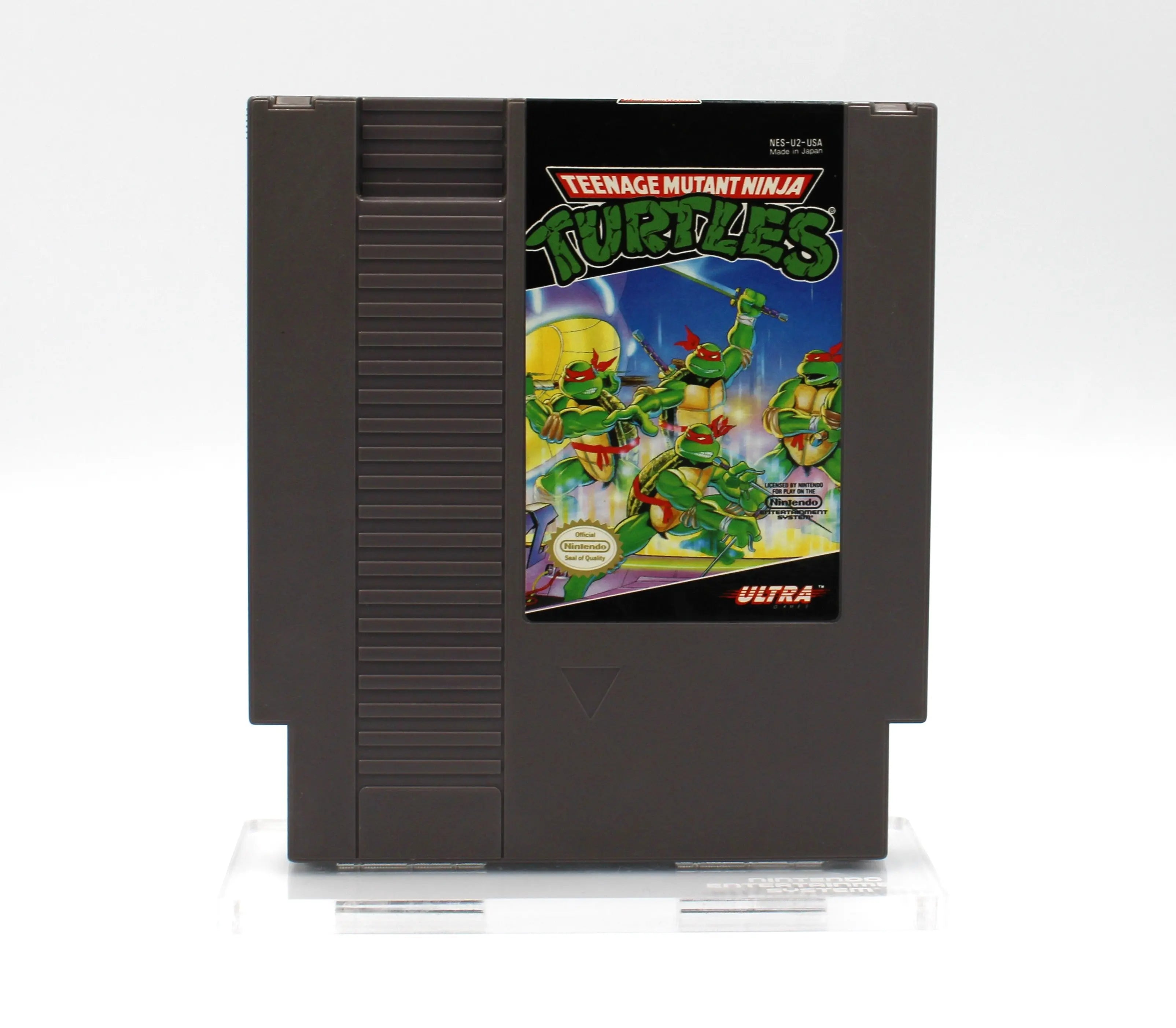 Front cartridge view of 1988 authentic NTSC-U copy of Teenage Mutant Ninja Turtles for the Nintendo NES. See photo of front of Game Cartridge with intact label and turtles design