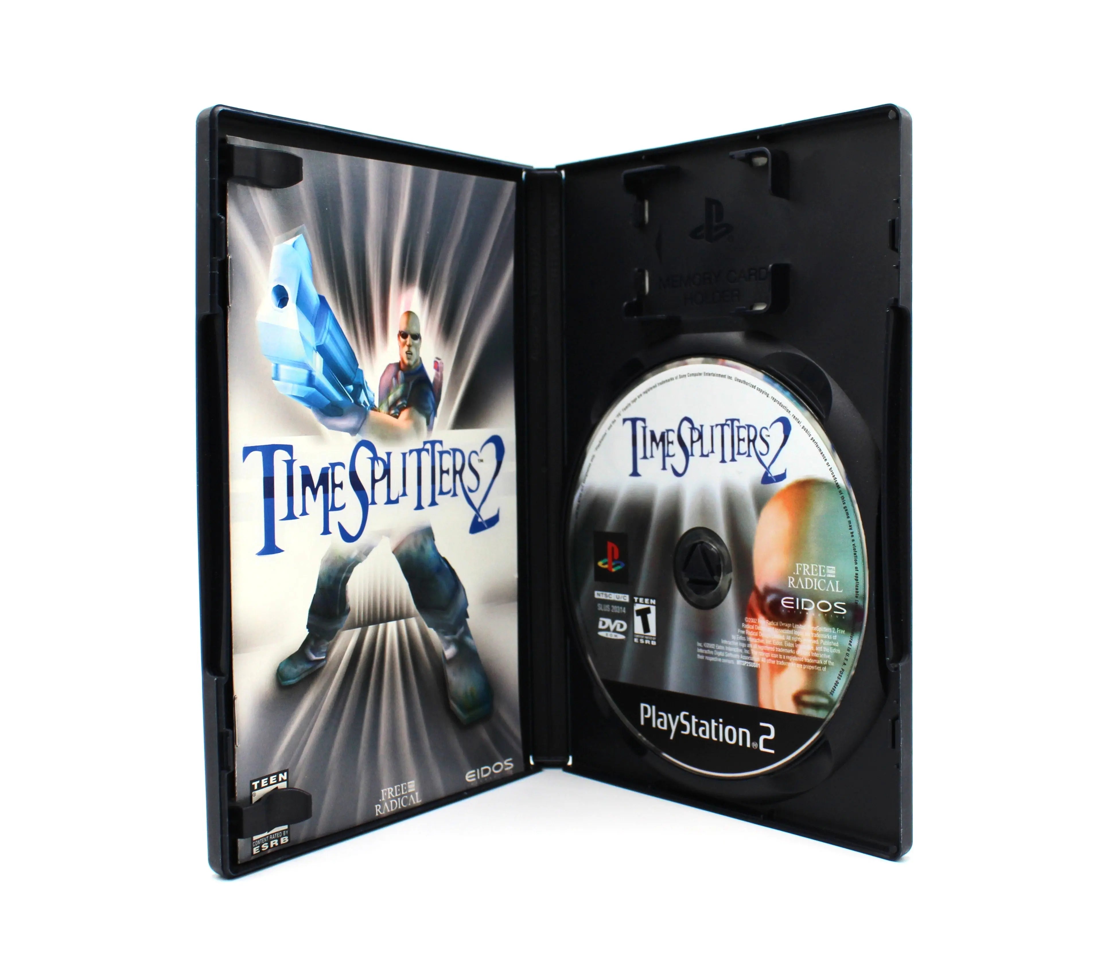 Open case view of CIB copy of TimeSplitters 2 for Sony PlayStation 2 PS2 – Complete with Manual (2002) NTSC‑U, showing manual and authentic disc inside.