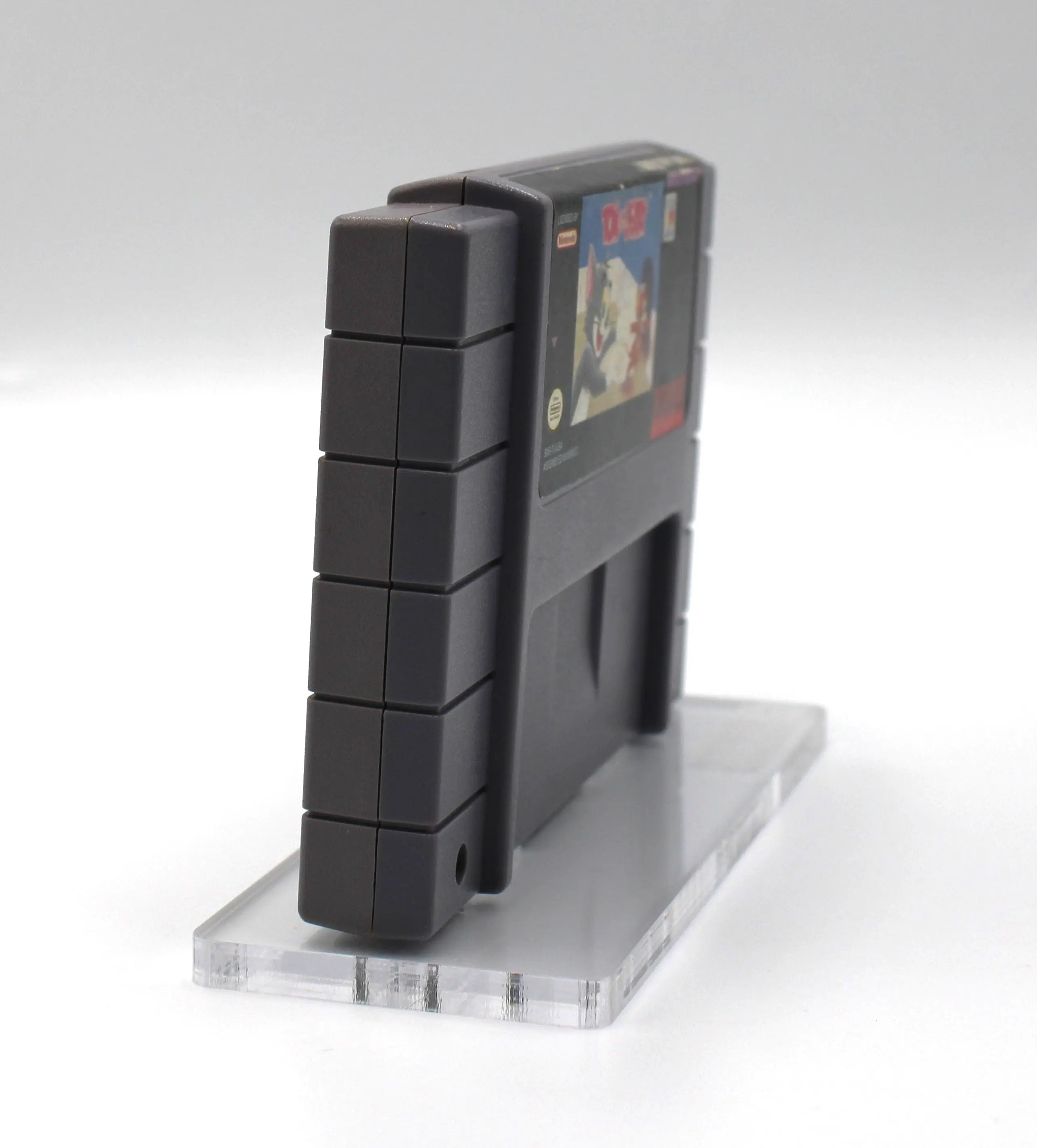 Right side angle of Tom and Jerry for Super Nintendo SNES (1993) NTSC-U, showing light cartridge discoloration from age and use.