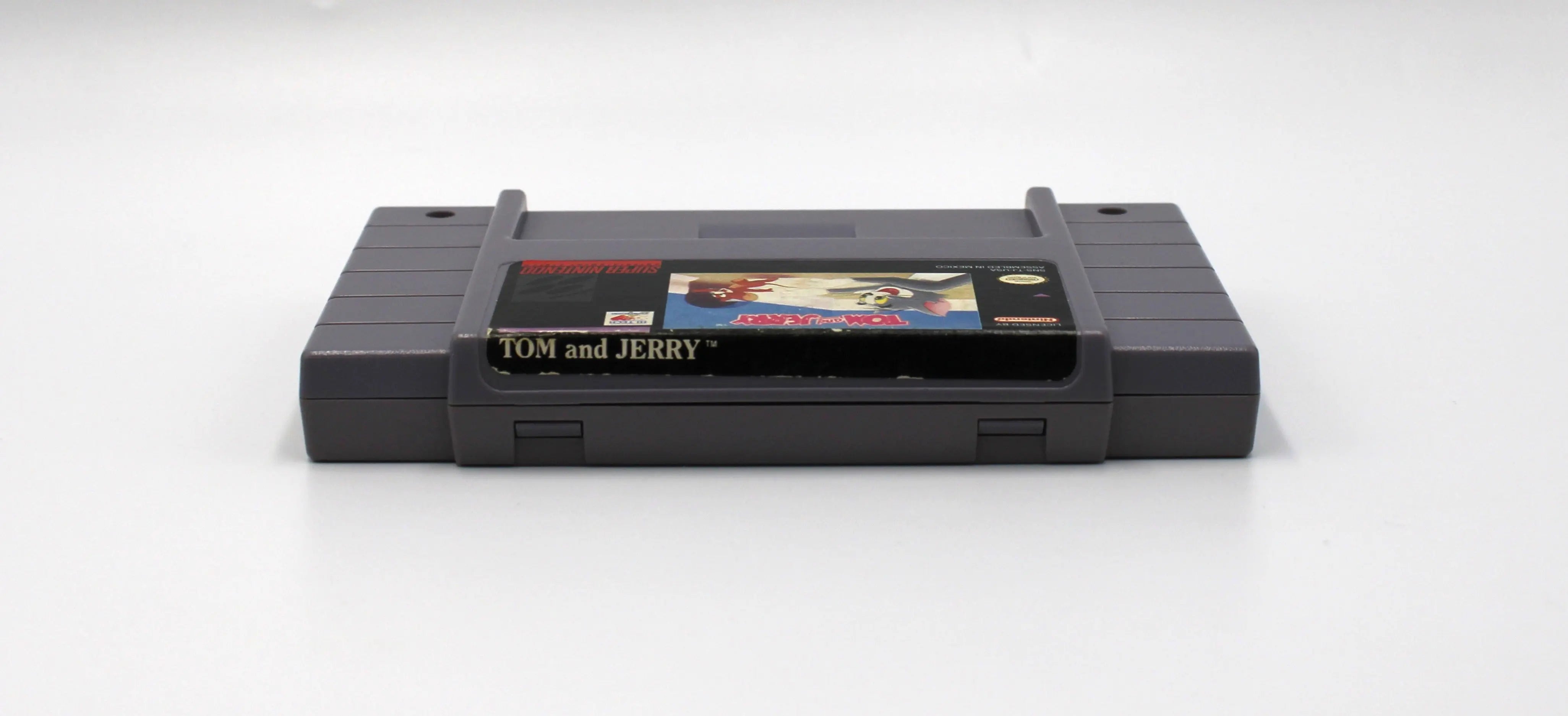 Top of Tom and Jerry for Super Nintendo SNES (1993) NTSC-U, showing top label with minor cosmetic wear and cartridge shape.