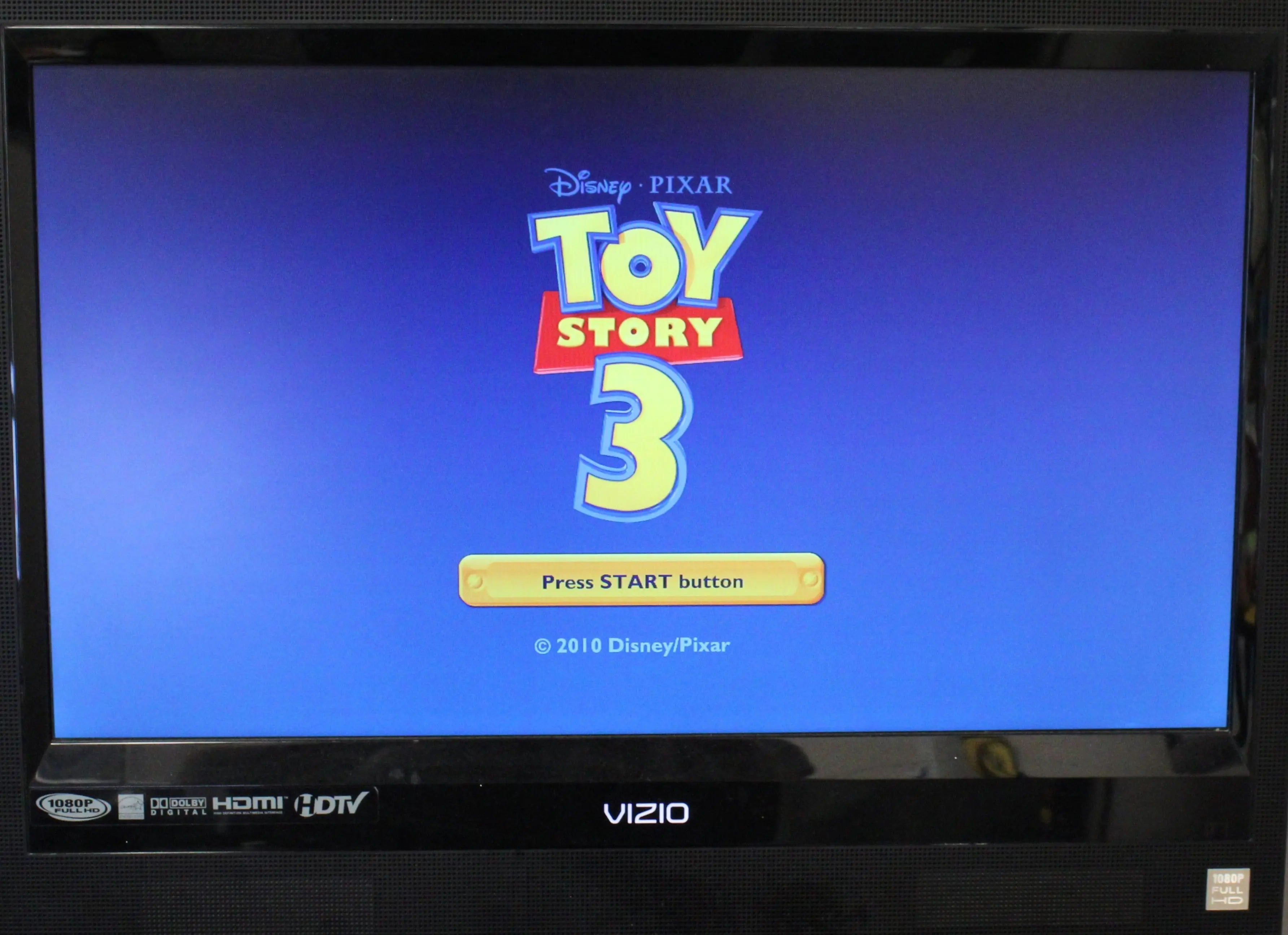 Gameplay image: Gameplay screenshot of Toy Story 3: The Video Game for Sony PlayStation PS3 NTSC‑U, featuring the main menu screen with the Toy Story 3 logo and menu options over a Disney - Pixar‑style backdrop.