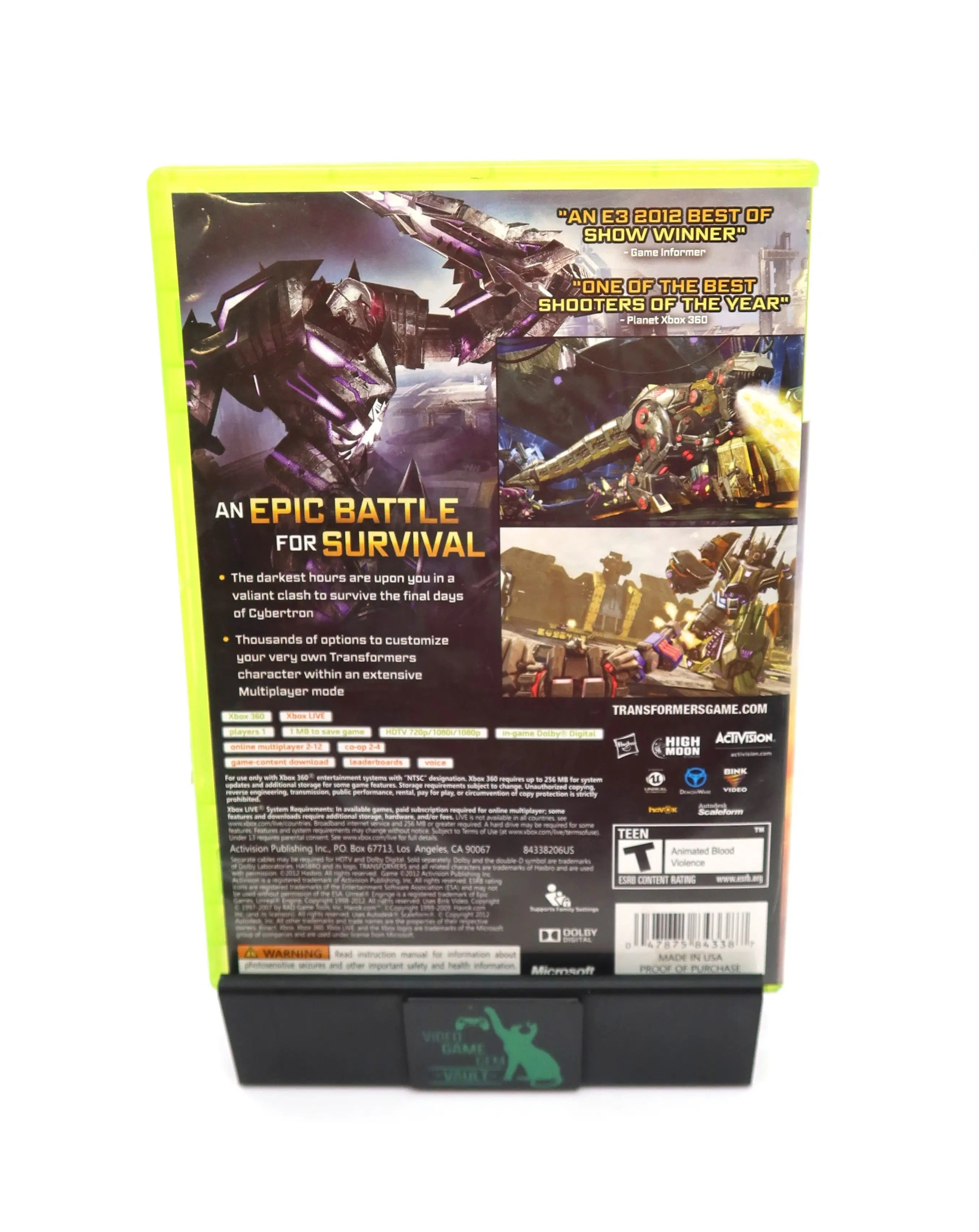 Back cover view of Transformers: Fall of Cybertron for Microsoft Xbox 360 (2012) NTSC-U, displaying gameplay screenshots, feature descriptions, and rating information.