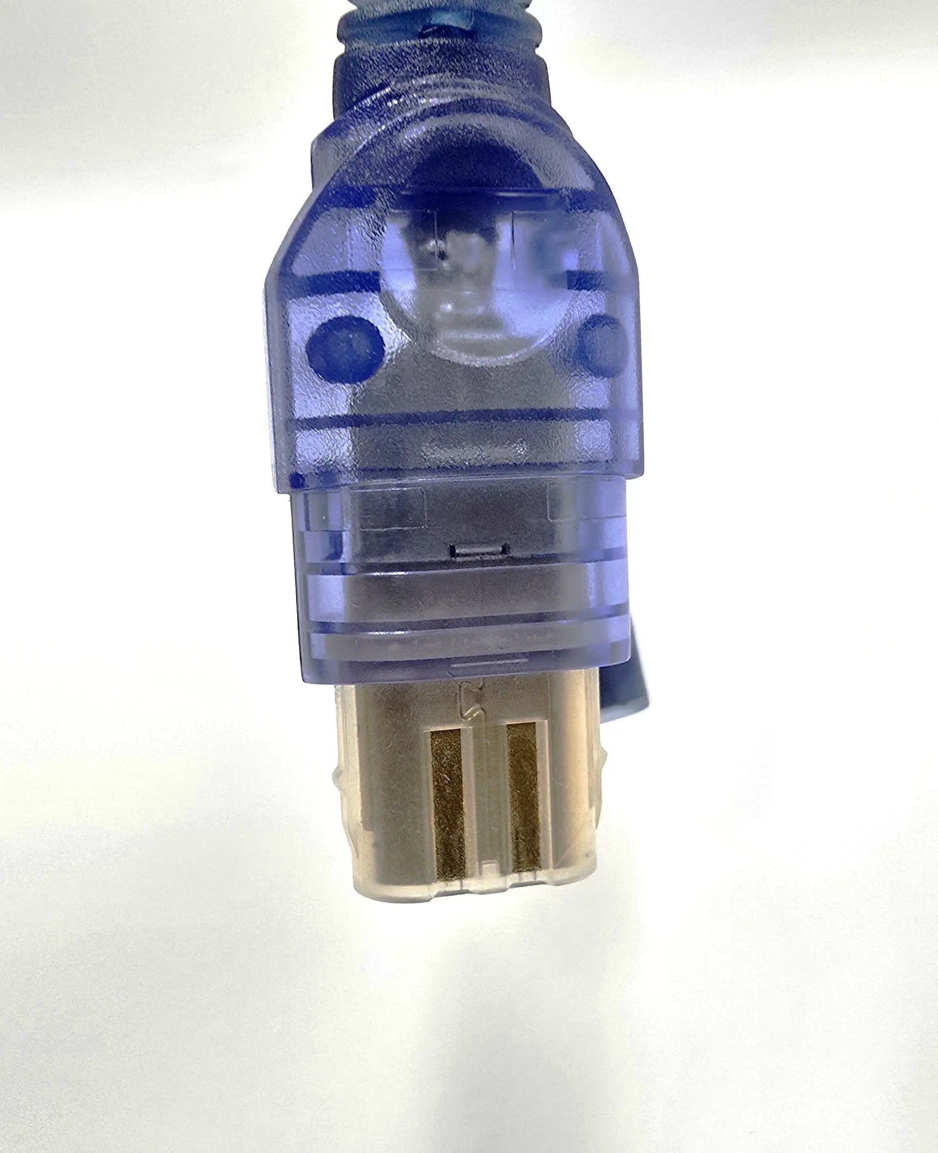 Close-up of  NTSC-U translucent blue male connector on third-party original Xbox breakaway cable, showing gold pins and molded plastic housing.
