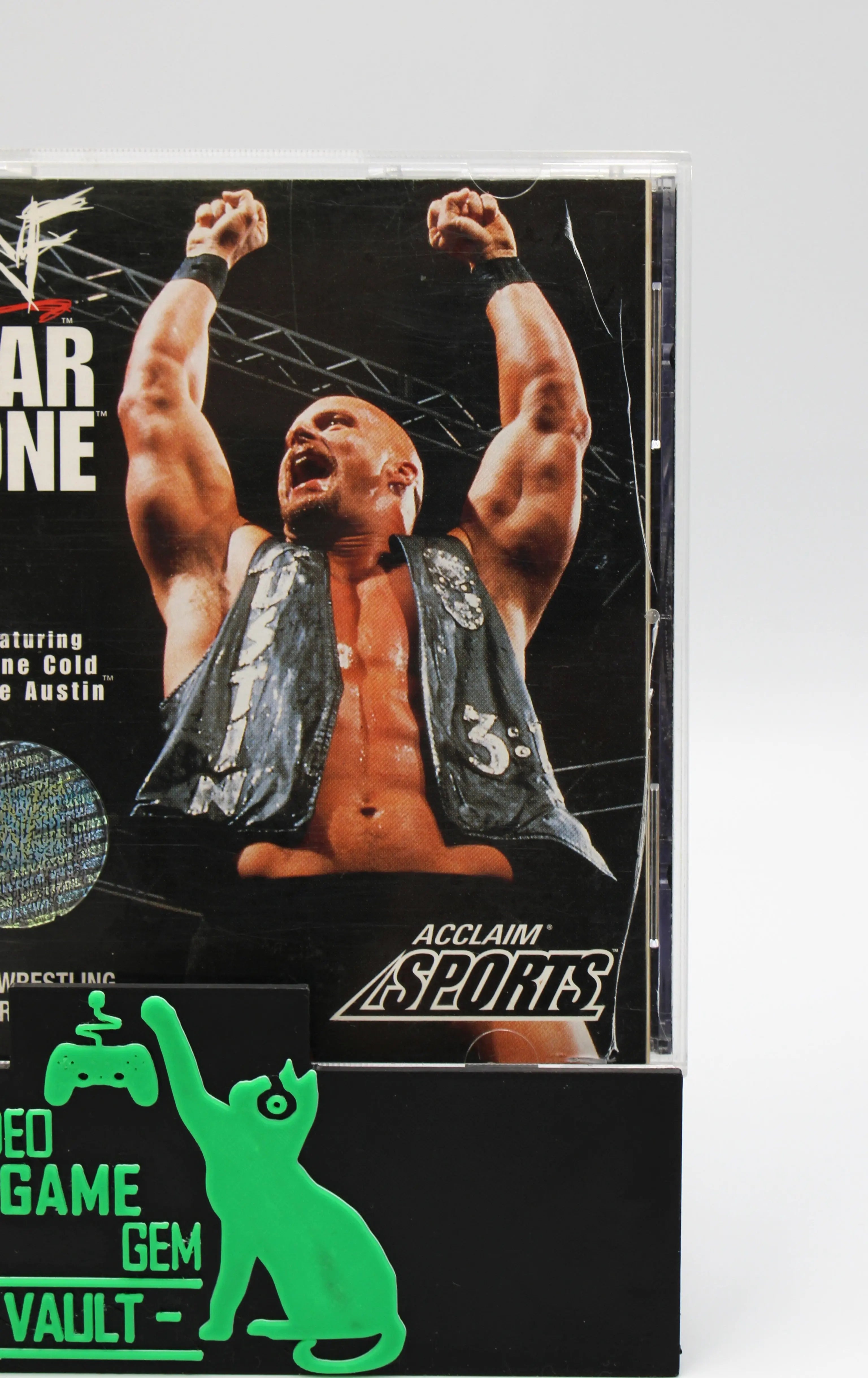 Large vertical hairline crack to OEM case with silver holo sticker for black label variant of WWF War Zone for the Sony PlayStation 1. Case is clean and intact with signs of cosmetic wear from age and use.