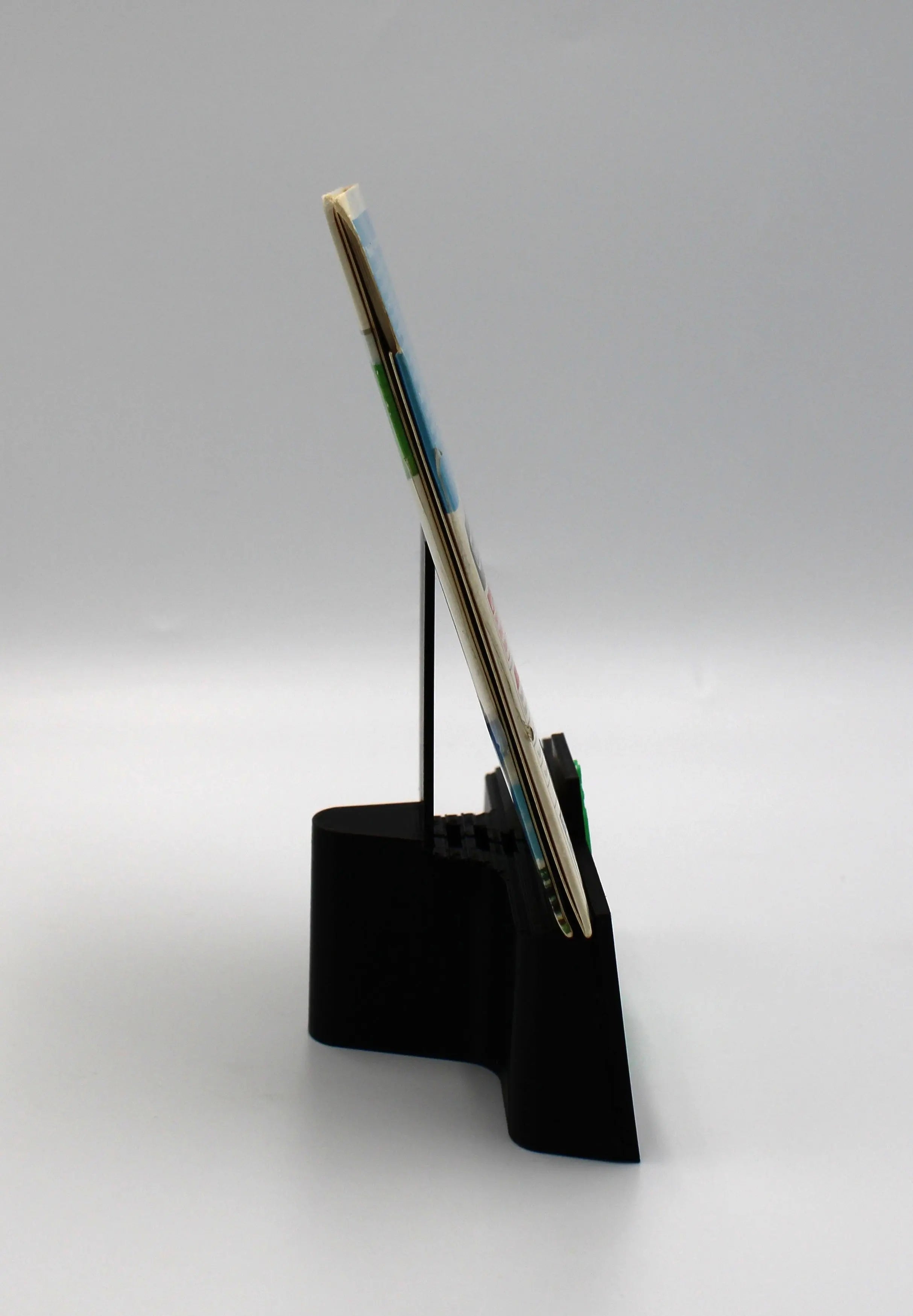 Spine opening view of a 2006 authentic NTSC-U copy of Wii Sports for Nintendo Wii n cardboard sleeve displayed against a clean white background showing intact case with disc secured.