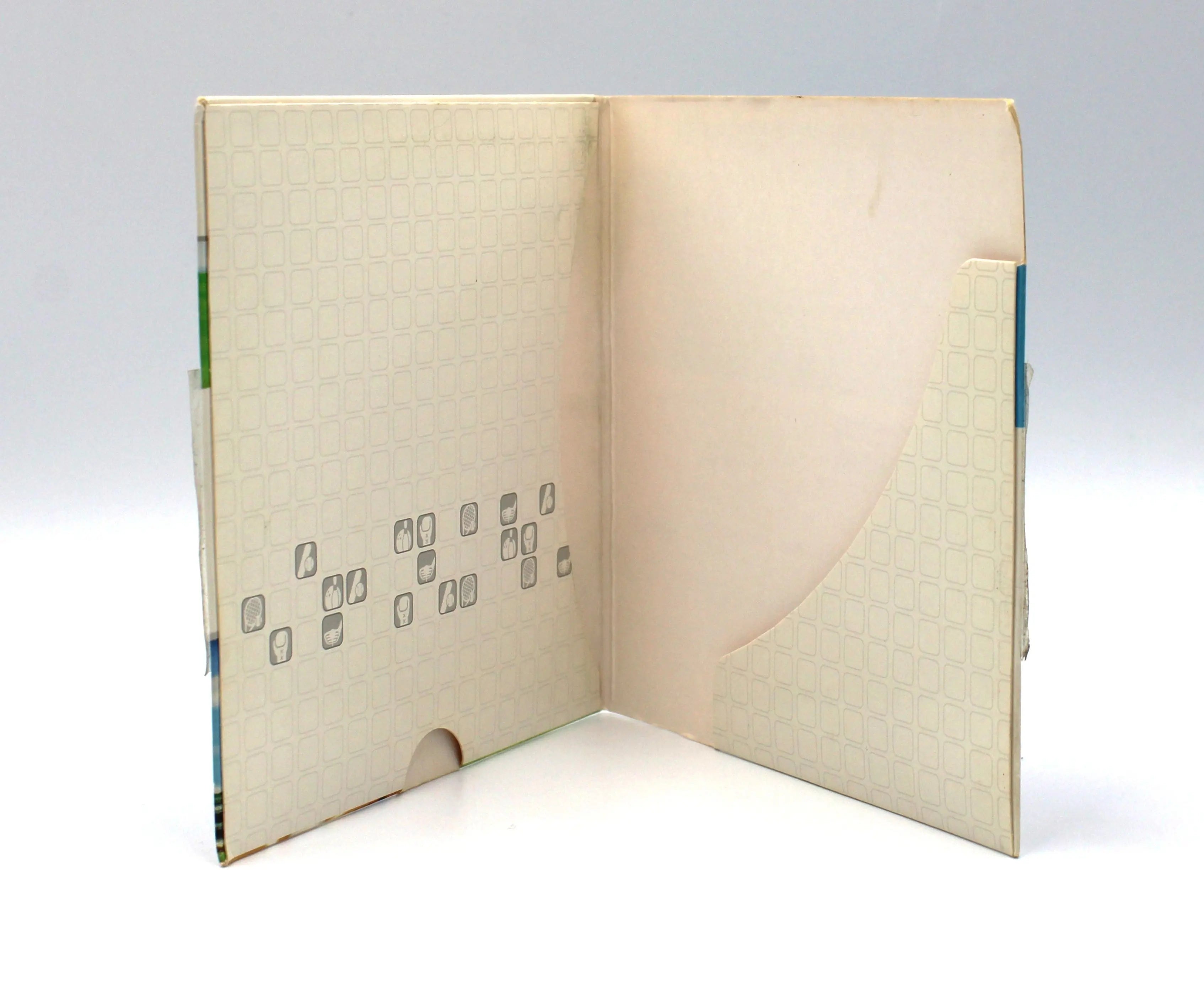 Empty opened view of a 2006 authentic NTSC-U copy of Wii Sports for Nintendo Wii in cardboard sleeve displayed against a clean white background. Highlighting intact case with yellowing or discoloration and some shelf wear from age and use.