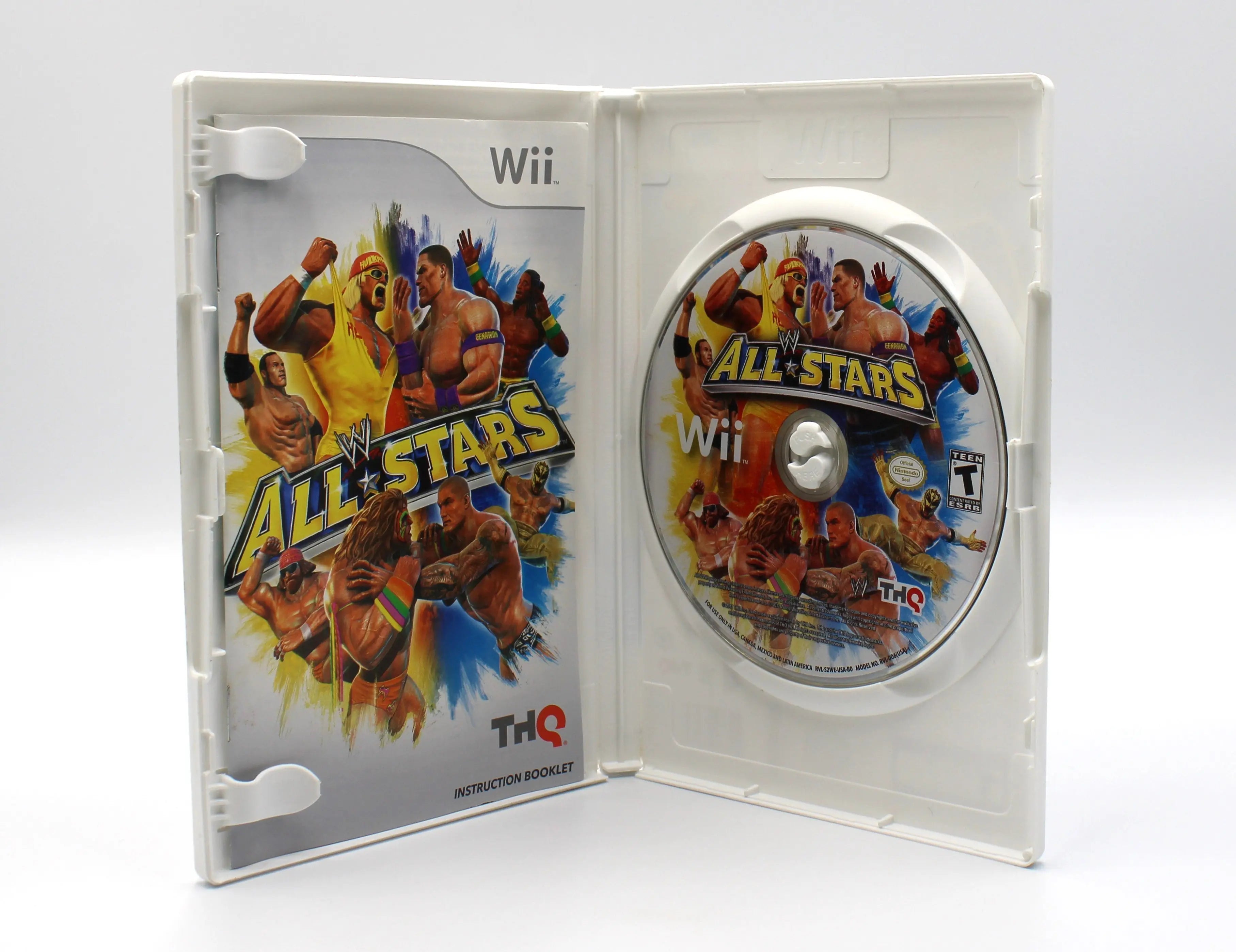 Open-case view of WWE All Stars for Nintendo Wii – CIB with Manual (2011) NTSC-U, displaying the manual in the left spine holder, disc in the right tray, and interior artwork.
