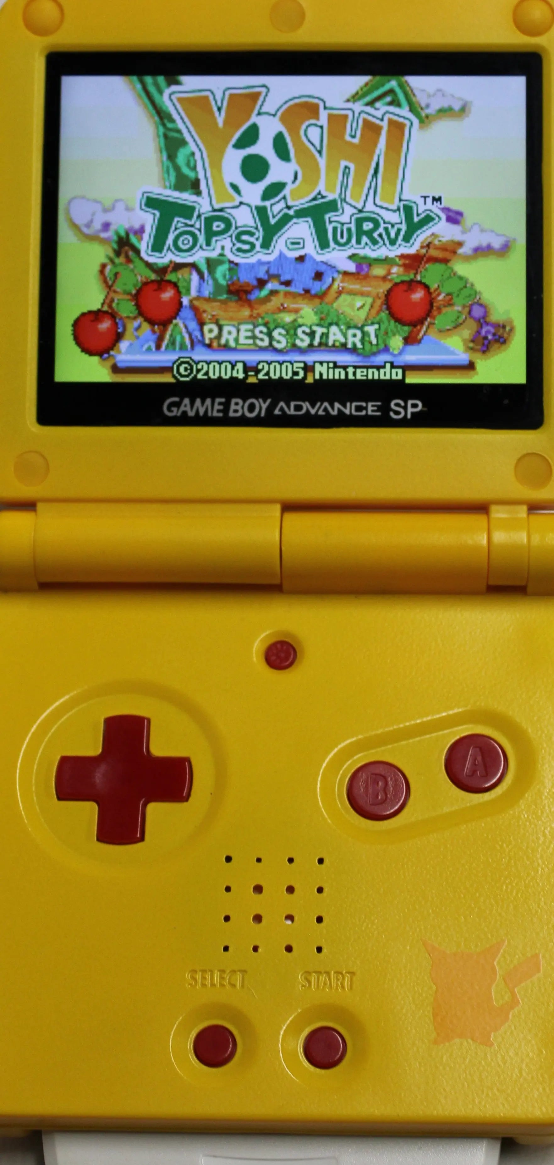 Main Menu gameplay image of Yoshi Topsy‑Turvy for Nintendo Game Boy Advance GBA – Authentic Game Cartridge (2005) NTSC‑U, showing gameplay main menu with press start option and game title text.